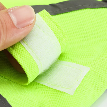 Flat view of the hi-vis dog vest showing the reflective strip and paw print detail